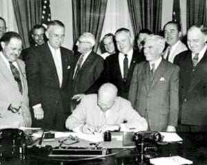 Eisenhower signing proclamation.