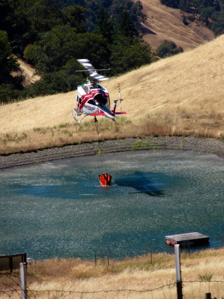 CalFire dipping into the pond at Happy Day Farms on Bell Springs Road, photo submitted by reader Mark O'Neill.