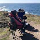 Teresa and Scott Mercer scope for whales off the Point Arena bluff (Lana Cohen / Mendocino Voice)